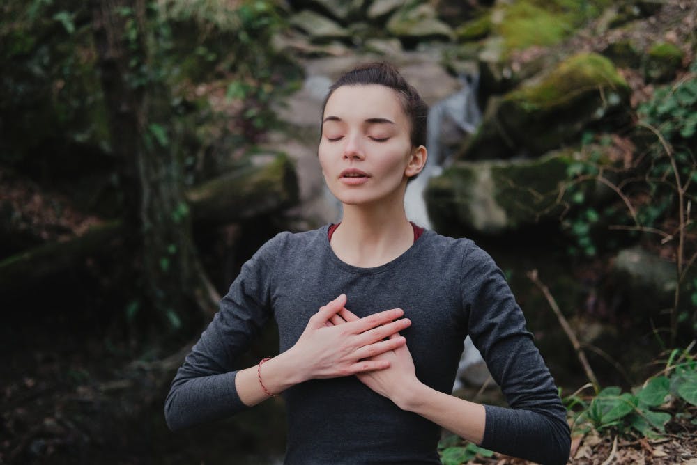 Woman breathing outdoors